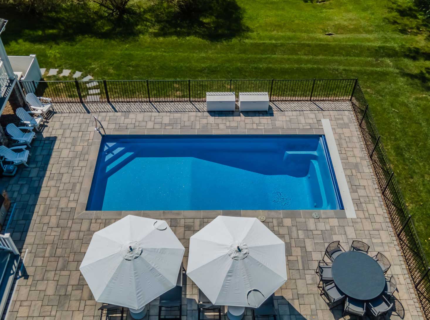 Aerial view of a Liberty fiberglass pool installed in a backyard